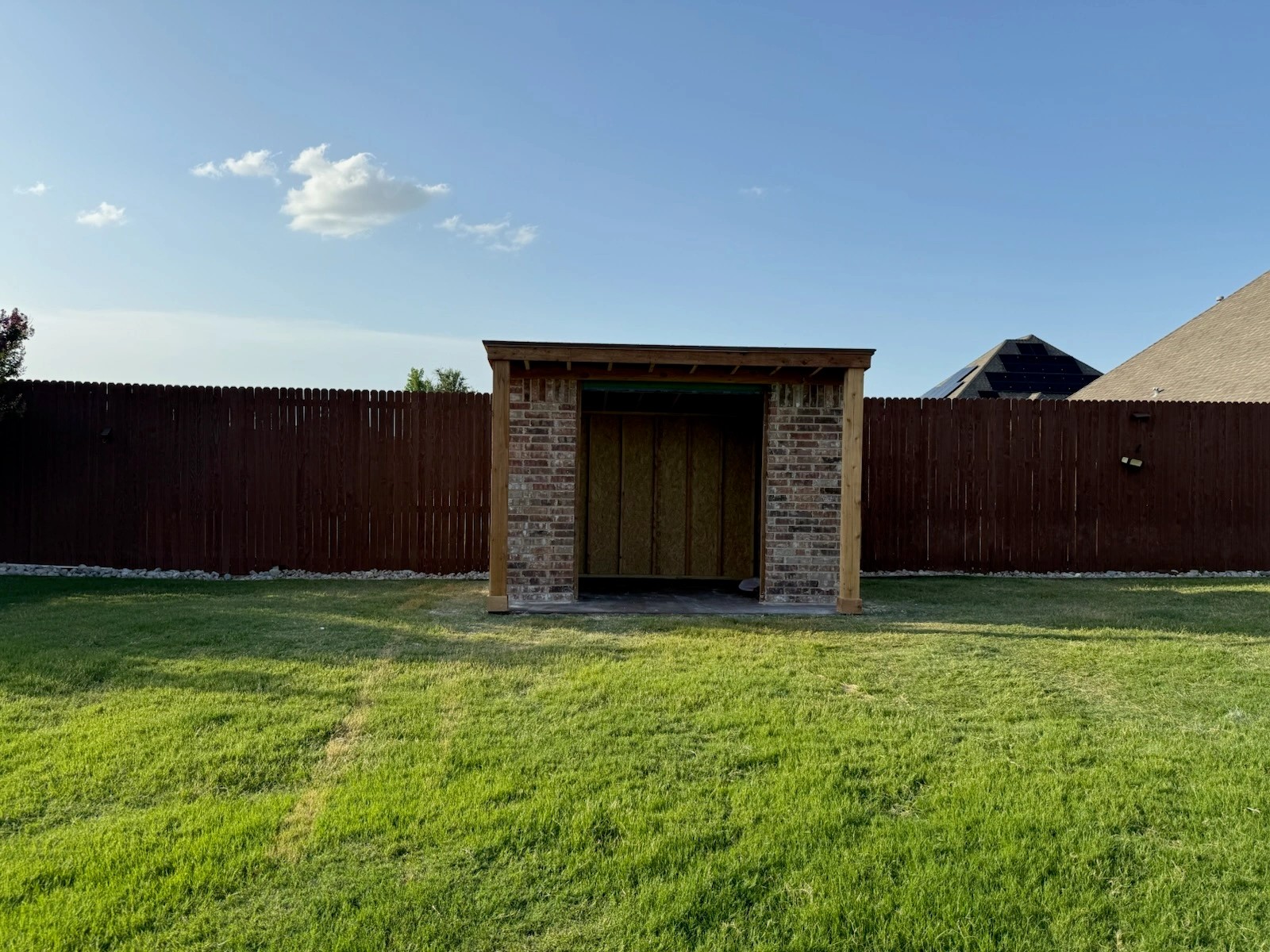 Finished brick shell of the storage building before doors were installed